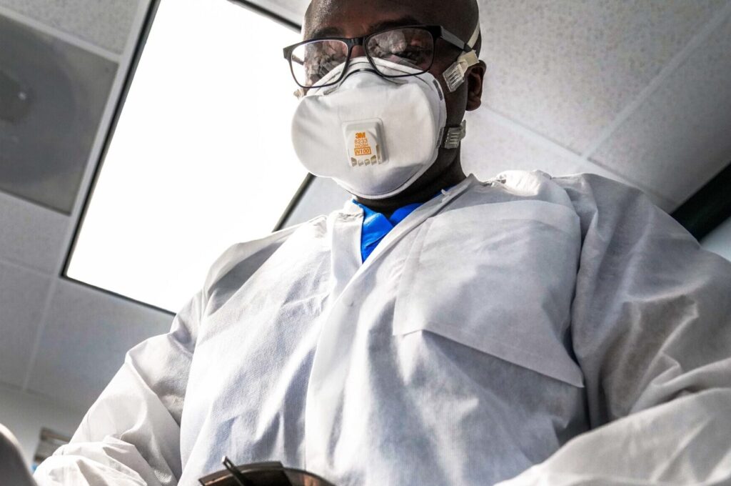Man wearing a face mask indoors