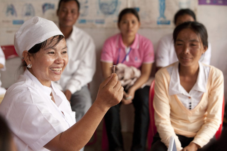 Women attend a group counseling session on methods of contraception led by PSI staff member Doung Mao.
